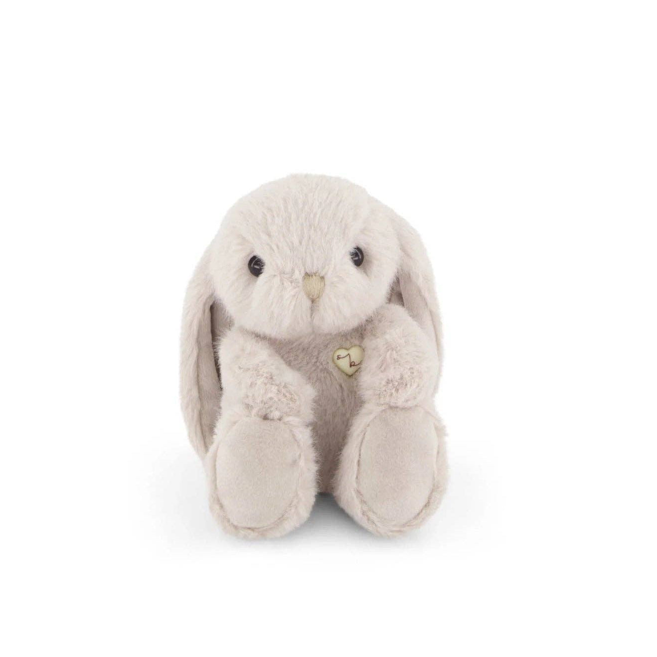 Plush rabbit toy with a heart on a white background