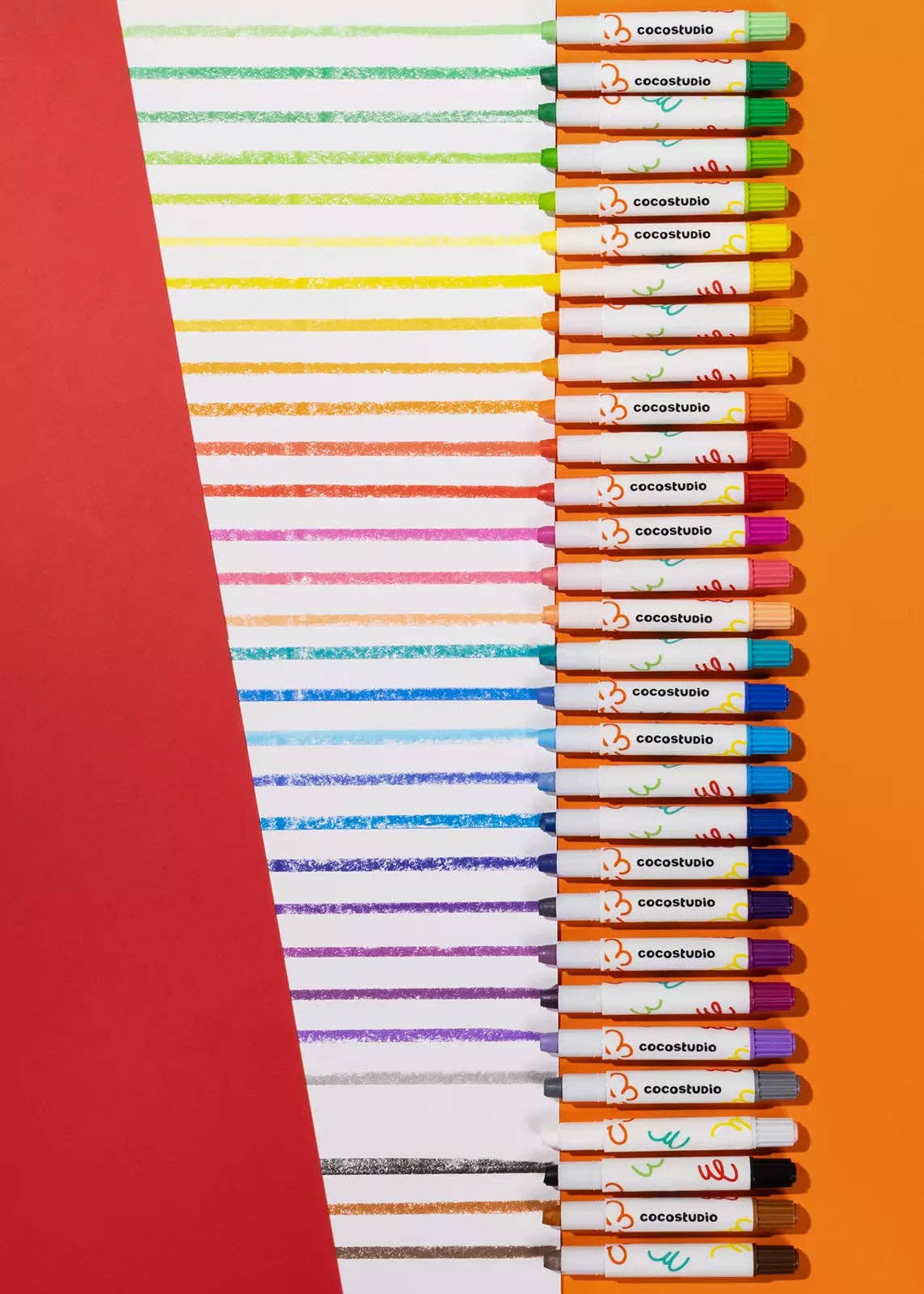 Set of colored pencils with colorful stripes on an orange background
