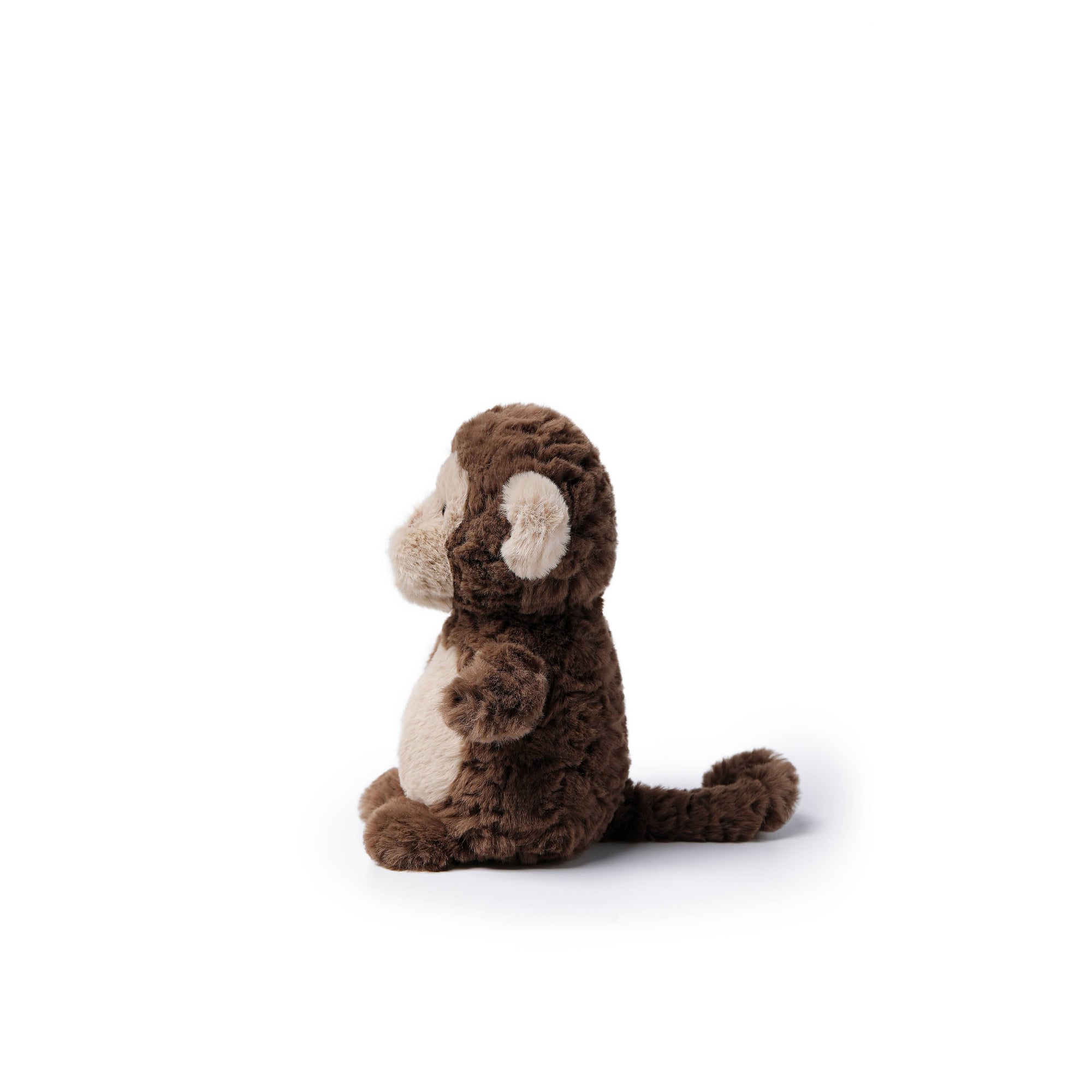A small plush monkey toy in dark brown with cream-colored face, belly, and ears, sitting on a plain white background.