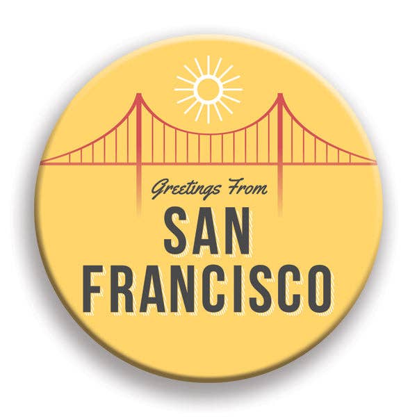 Round yellow badge with a red bridge illustration and 'Greetings From San Francisco' text on a white background