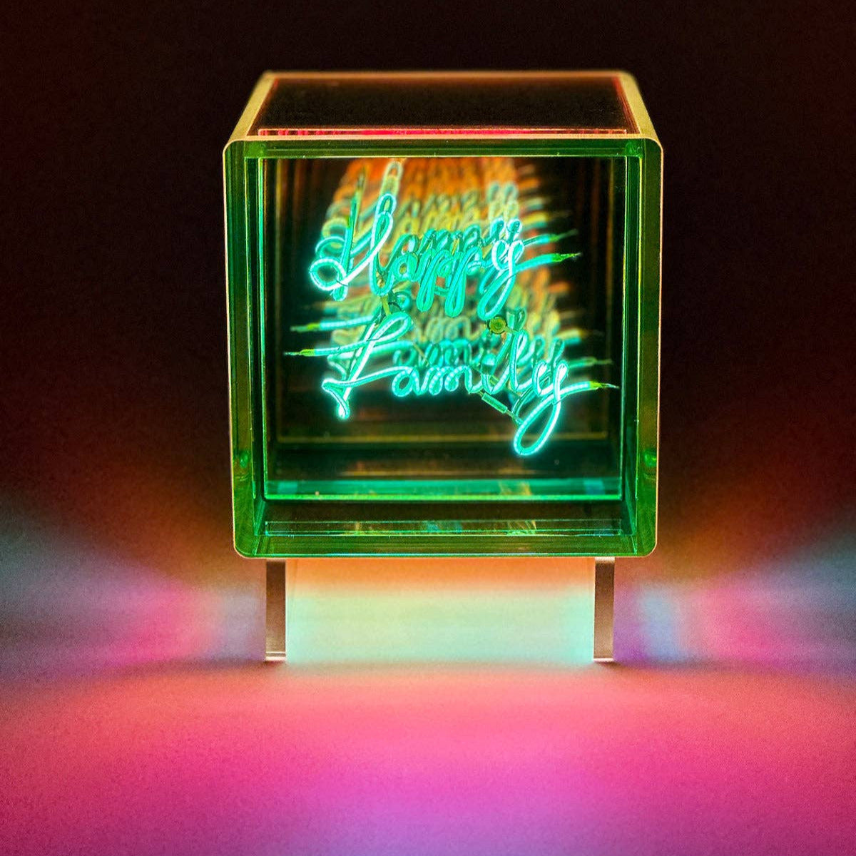 Neon-style text in a glowing cube on a dark background