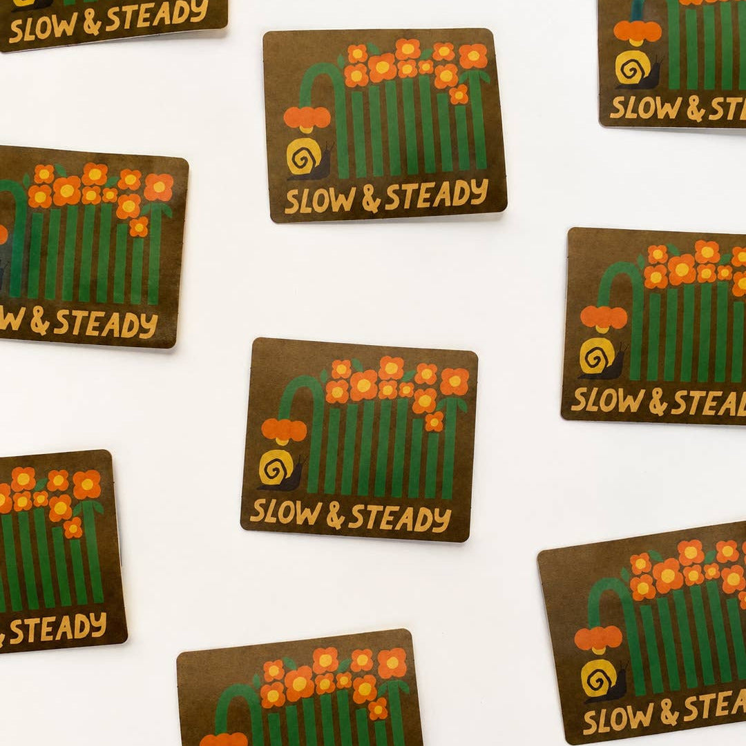 Stickers with 'Slow & Steady' text and design on a white background