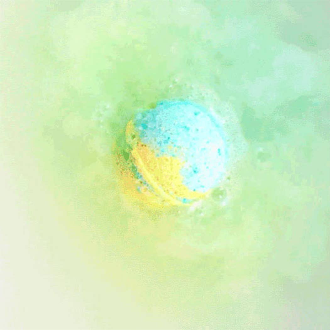 Bubbly bath bomb with a colorful swirl on a green and yellow gradient background