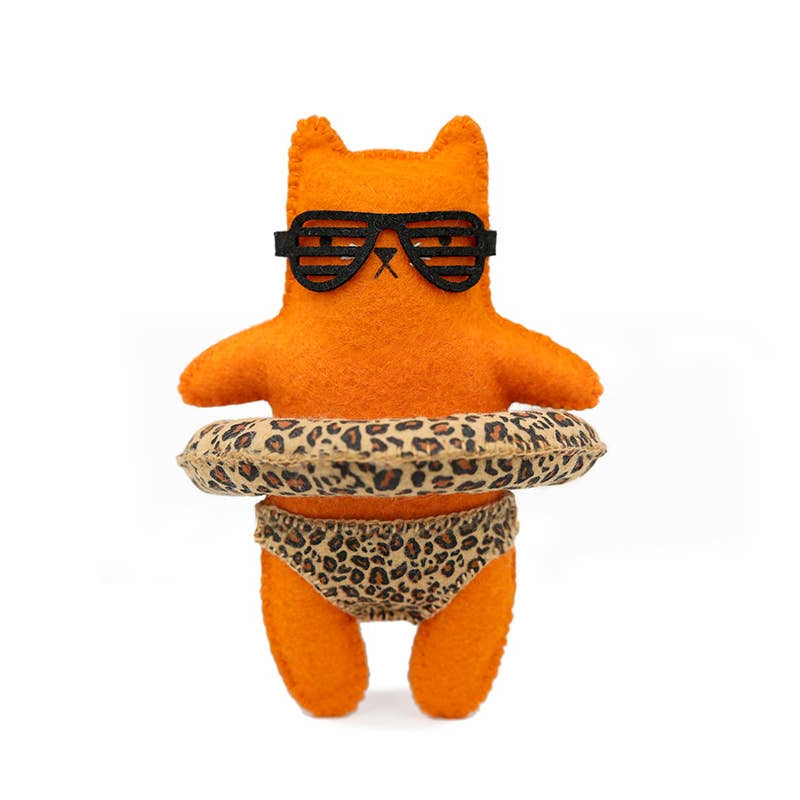 Orange plush toy with sunglasses and leopard print shorts on a white background