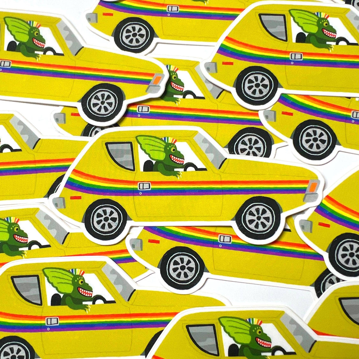 Repeating pattern of a yellow car with a green dragon driver and rainbow stripes on a white background.