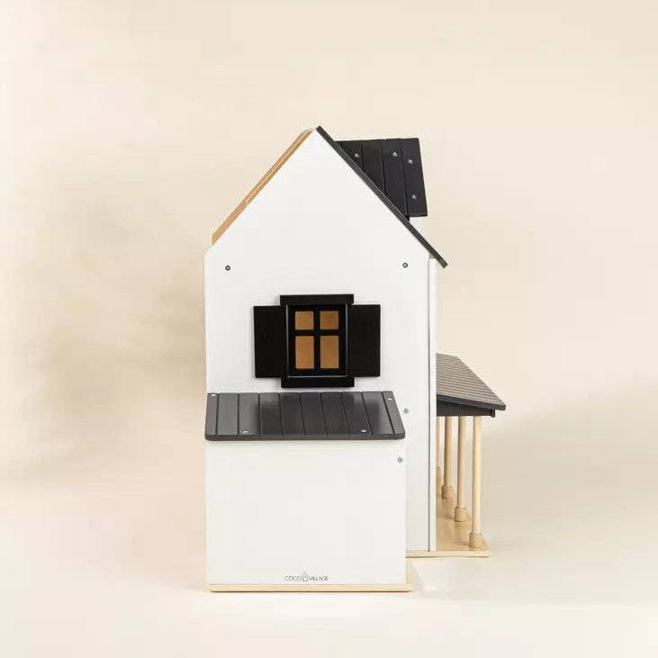 Small house-shaped object on a beige background
