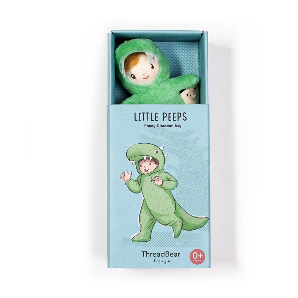 Green dinosaur toy in a box labeled 'Little Peeps' by ThreadBear Design on a white background.