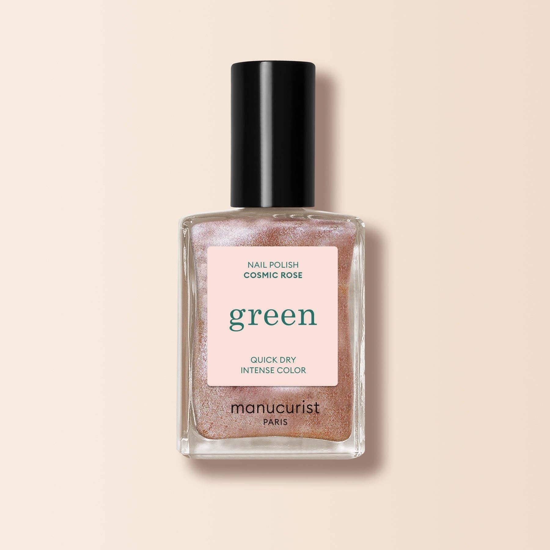Nail polish bottle with 'manucurist' label on a beige background