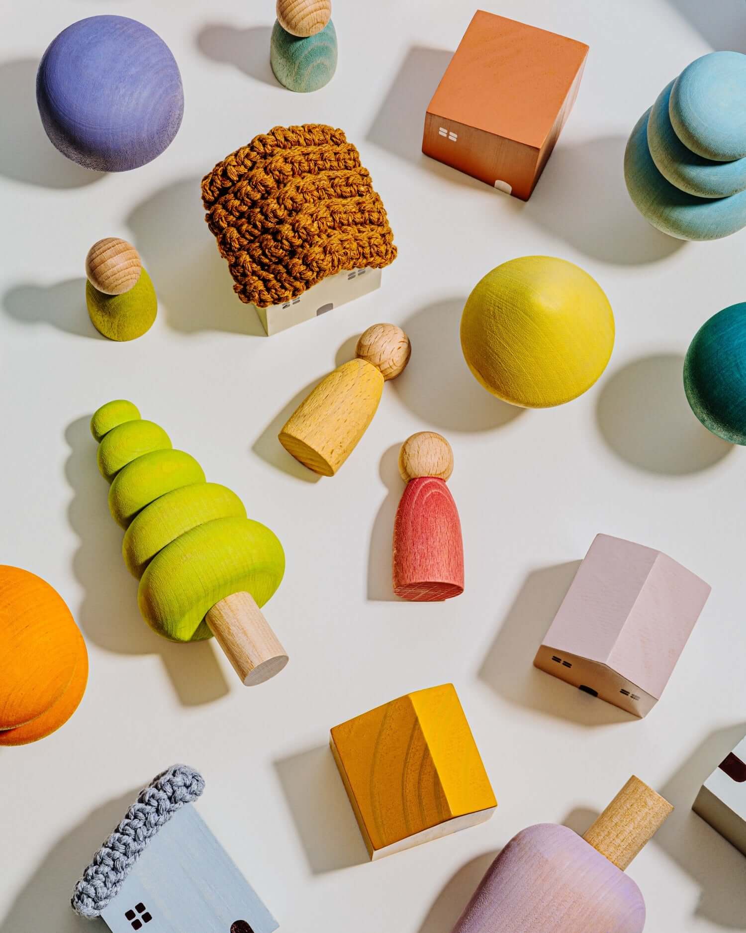 Colorful wooden toys on a light background