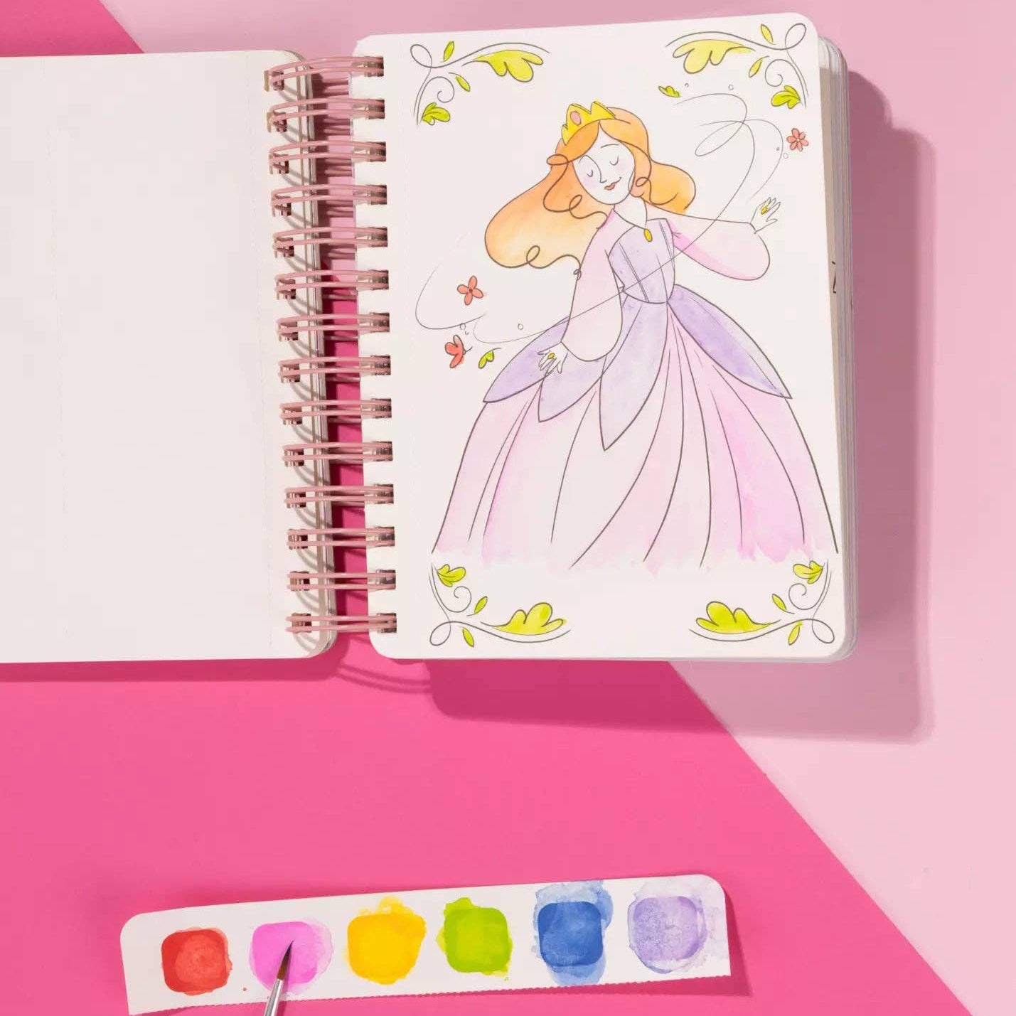 Notebook with princess illustration on a pink background