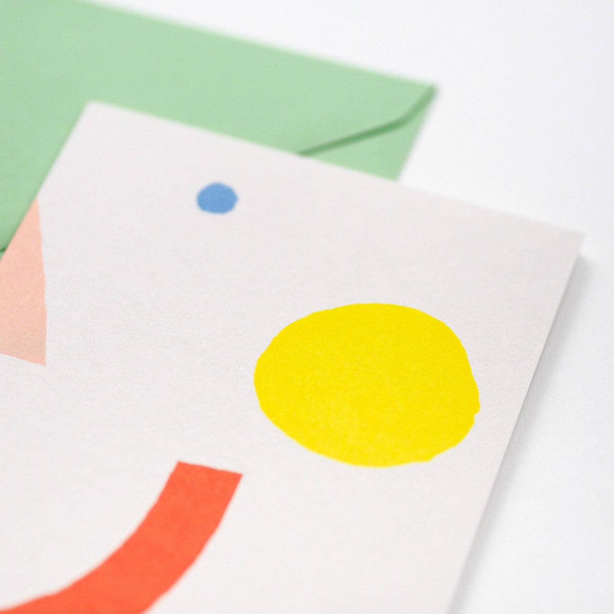 Card with colorful geometric design on a white background