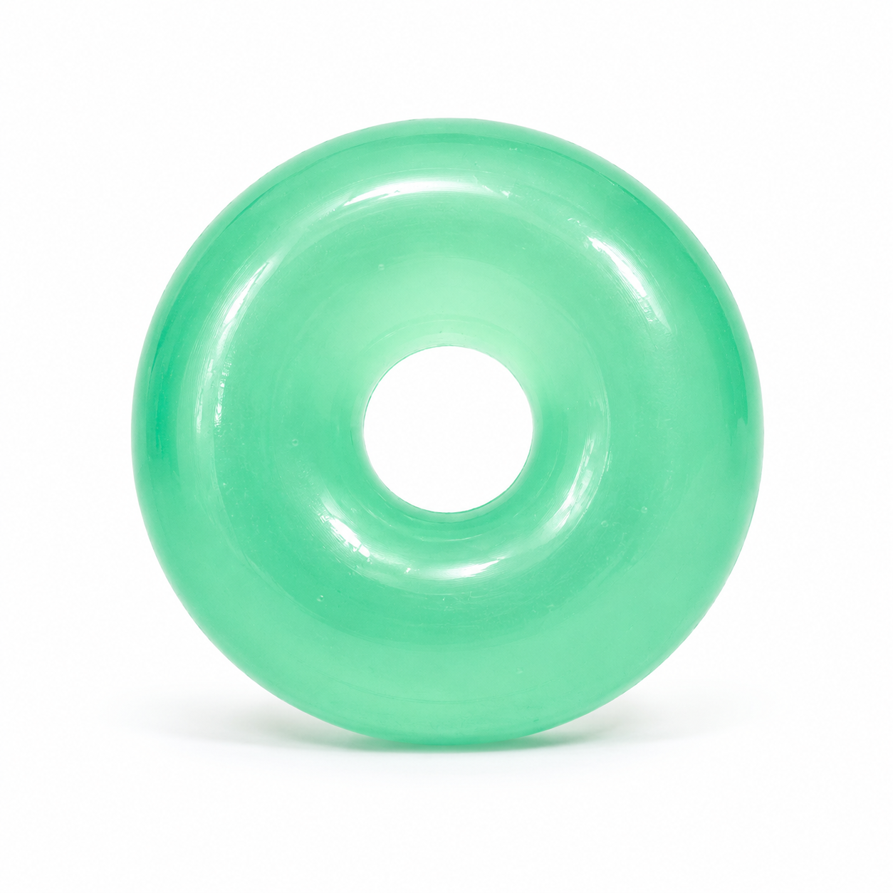Green donut-shaped object on a white background