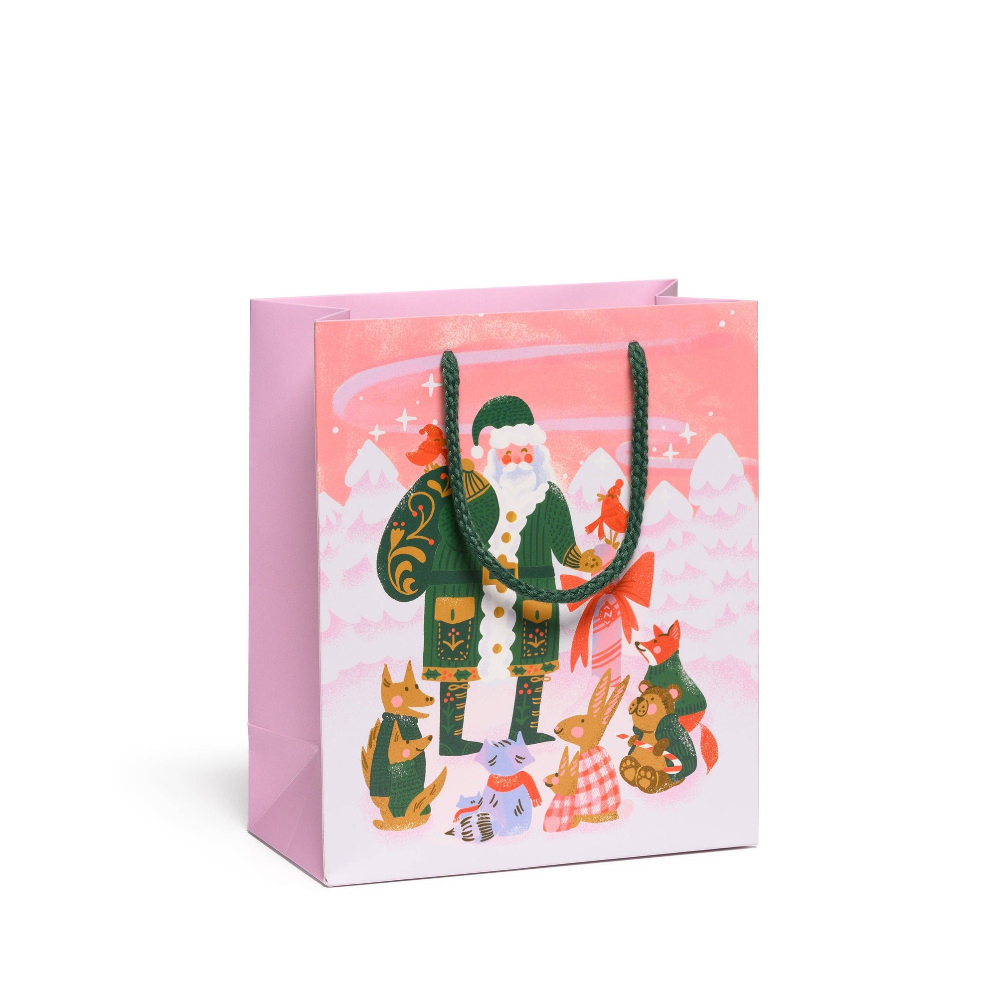 Gift bag with a festive design featuring Santa Claus and animals on a pink background