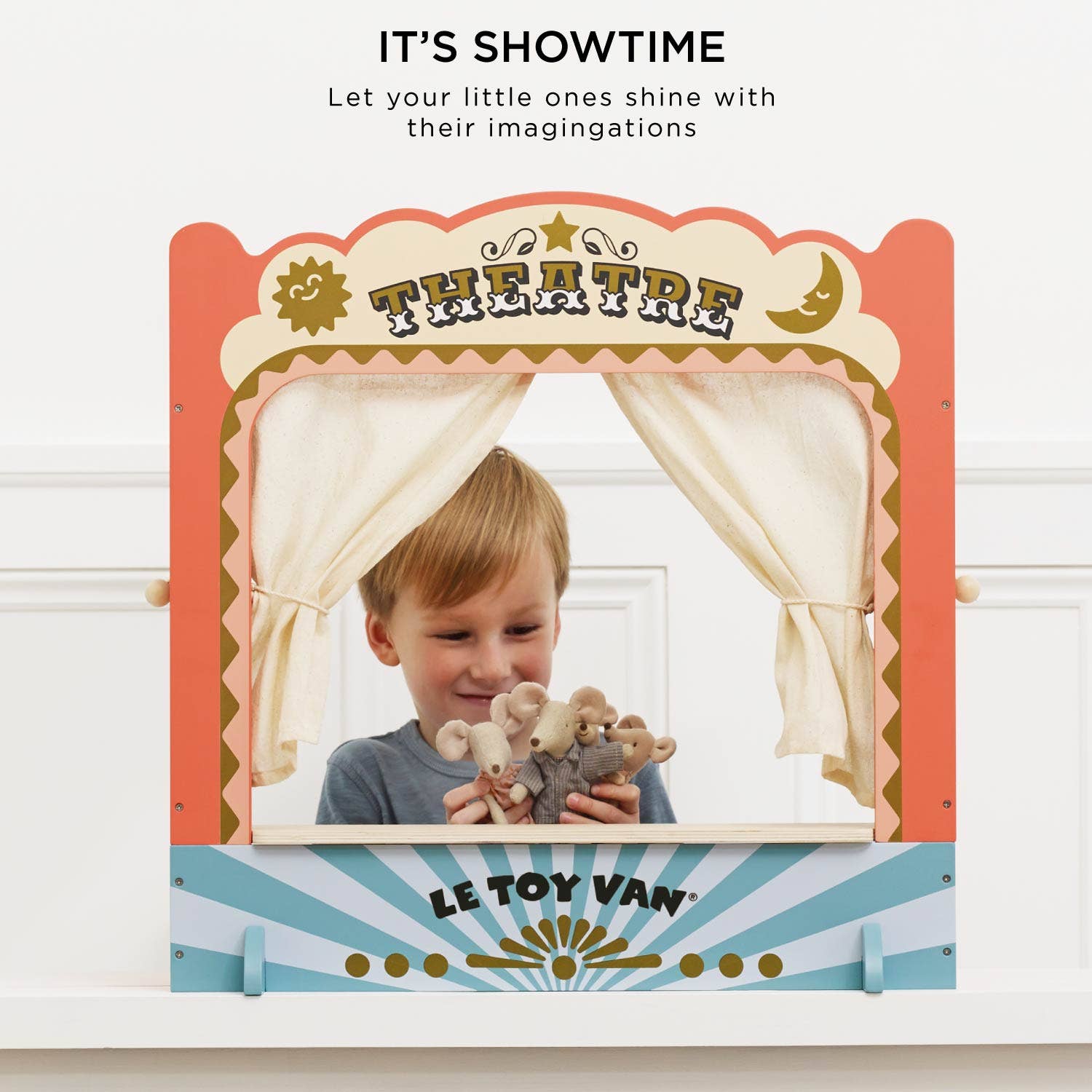 Children's theatre set with a boy holding teddy bears, featuring Le Toy Van branding.
