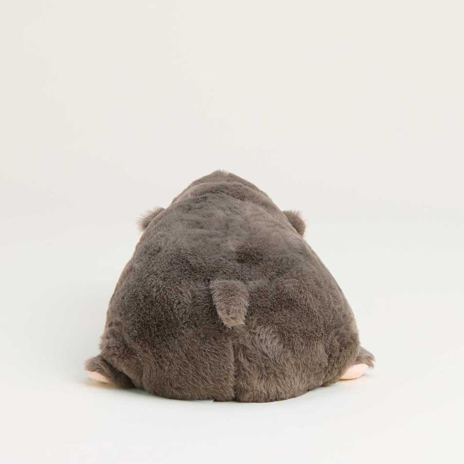 Plush toy resembling a hippo on a white background