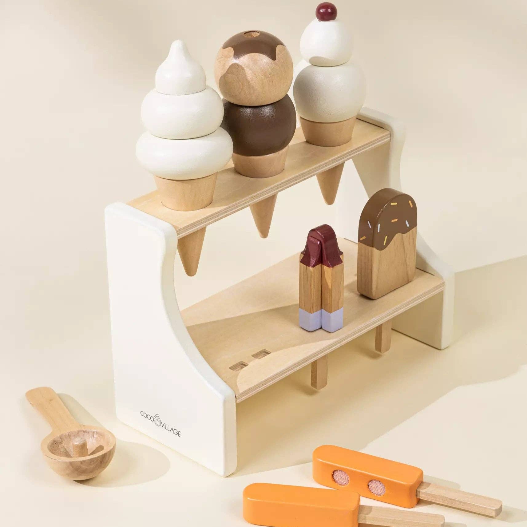 Wooden toy ice cream set with a stand on a light background