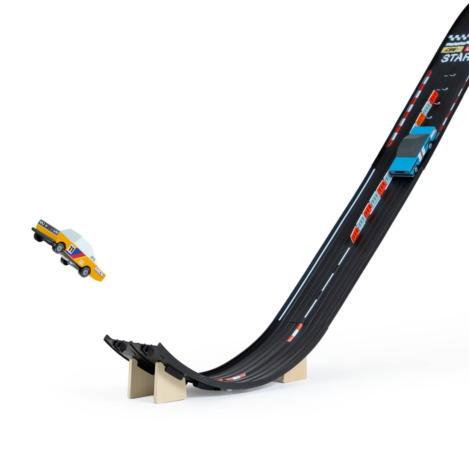 Toy race track with a car on a white background