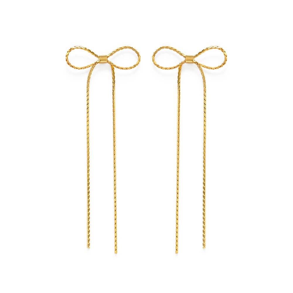Pair of gold bow-shaped earrings on a white background