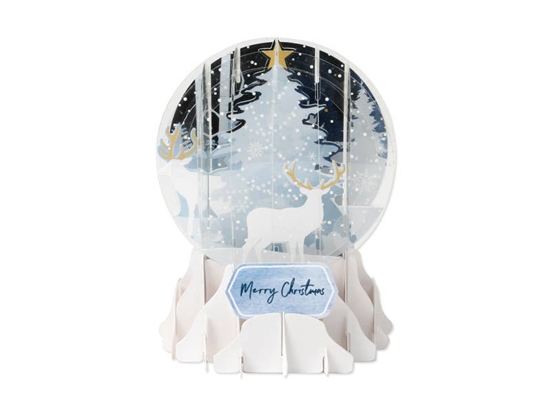 Decorative snow globe with a deer and forest design, featuring a 'Merry Christmas' tag.