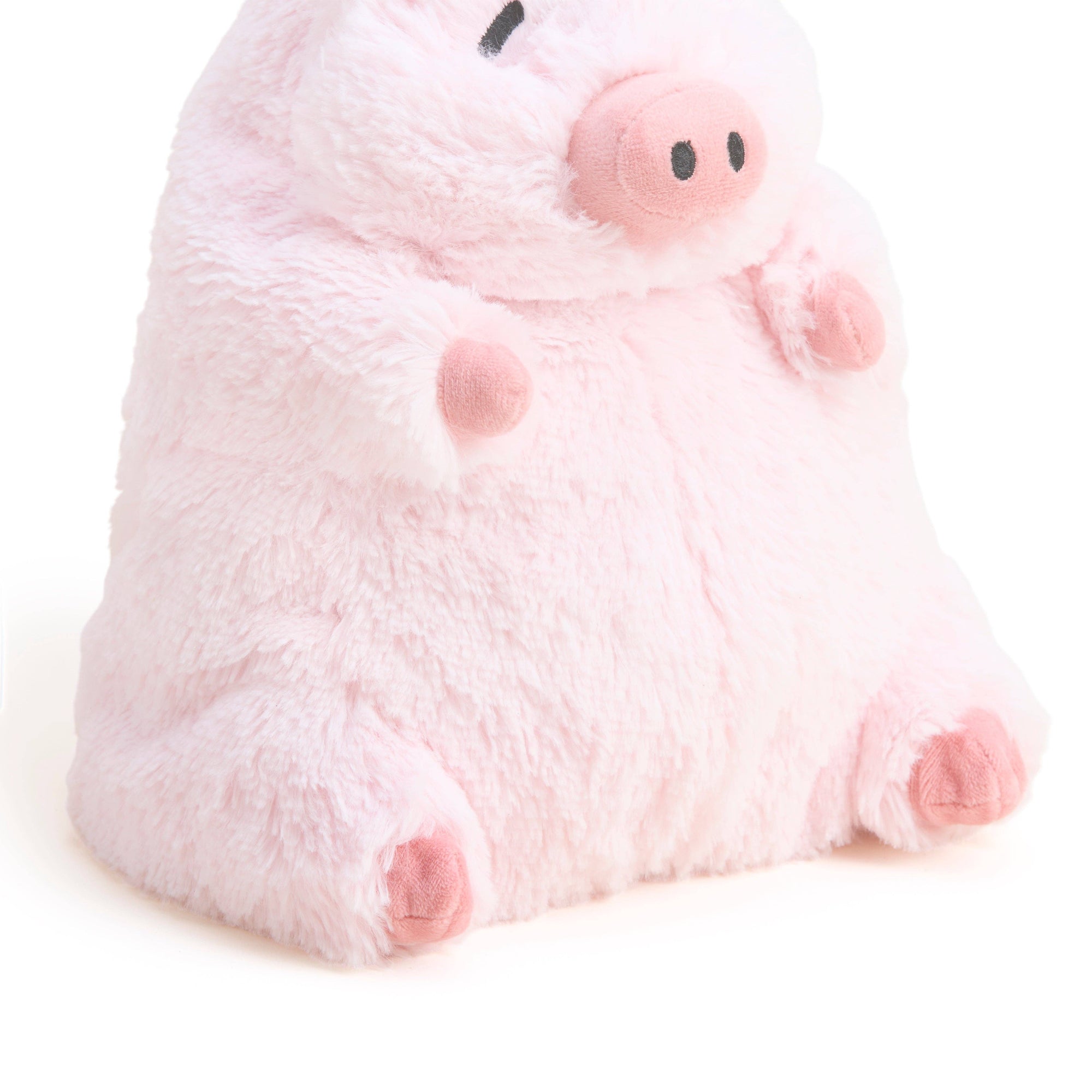 Plush toy pig on a white background