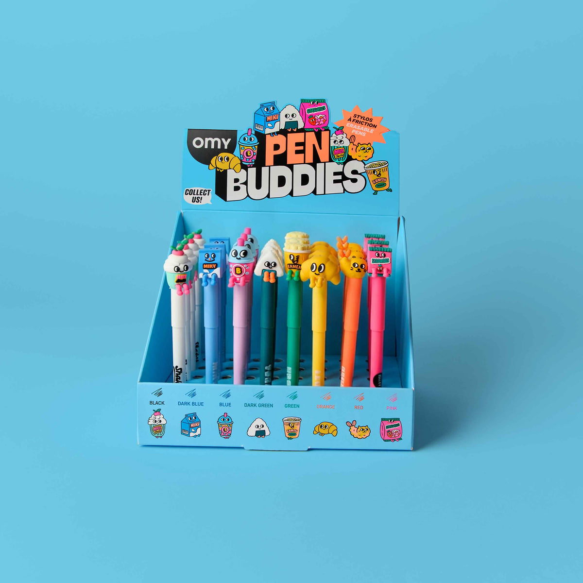 Display of colorful pen buddies with OMY branding on a blue background