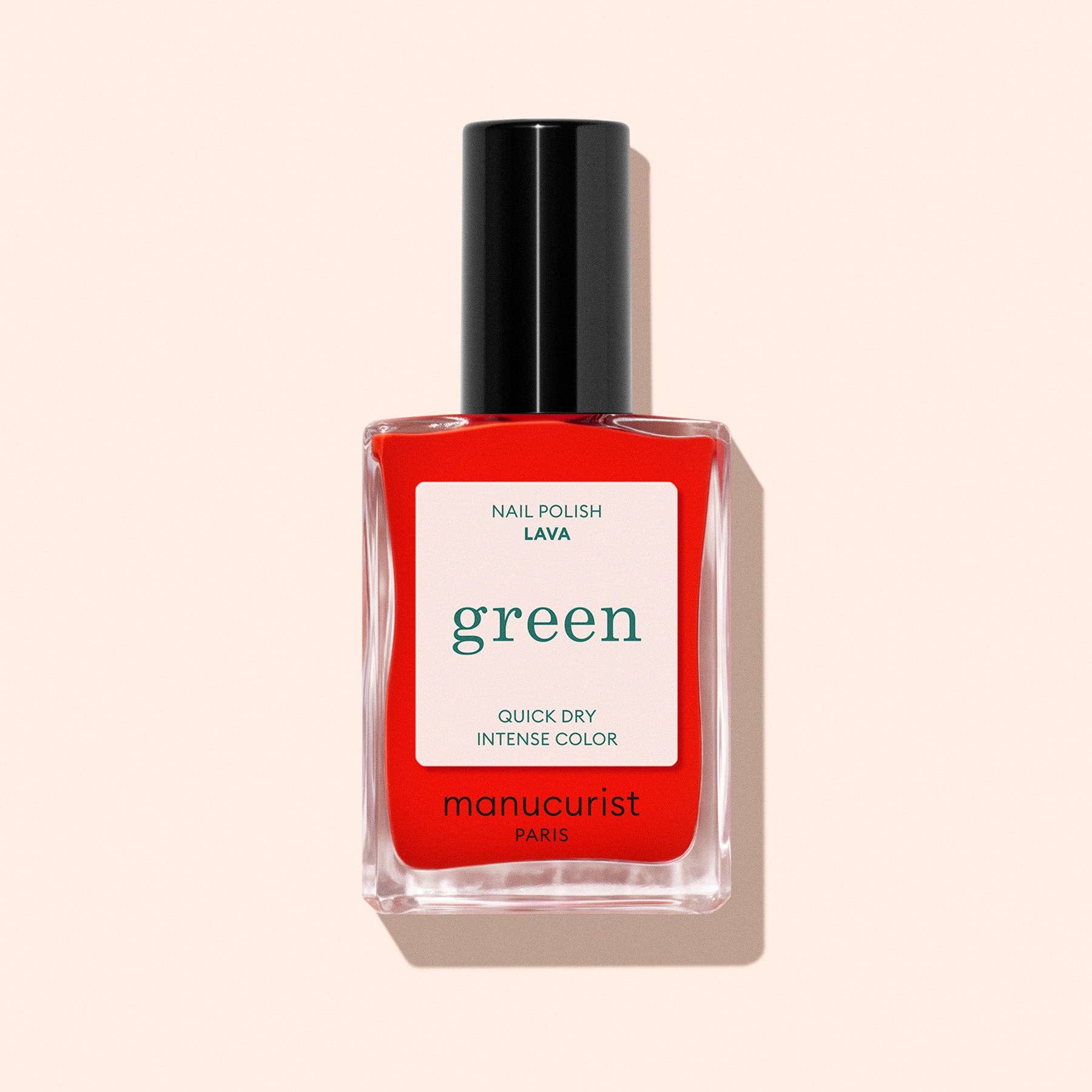 Manucurist nail polish bottle with red label on a beige background