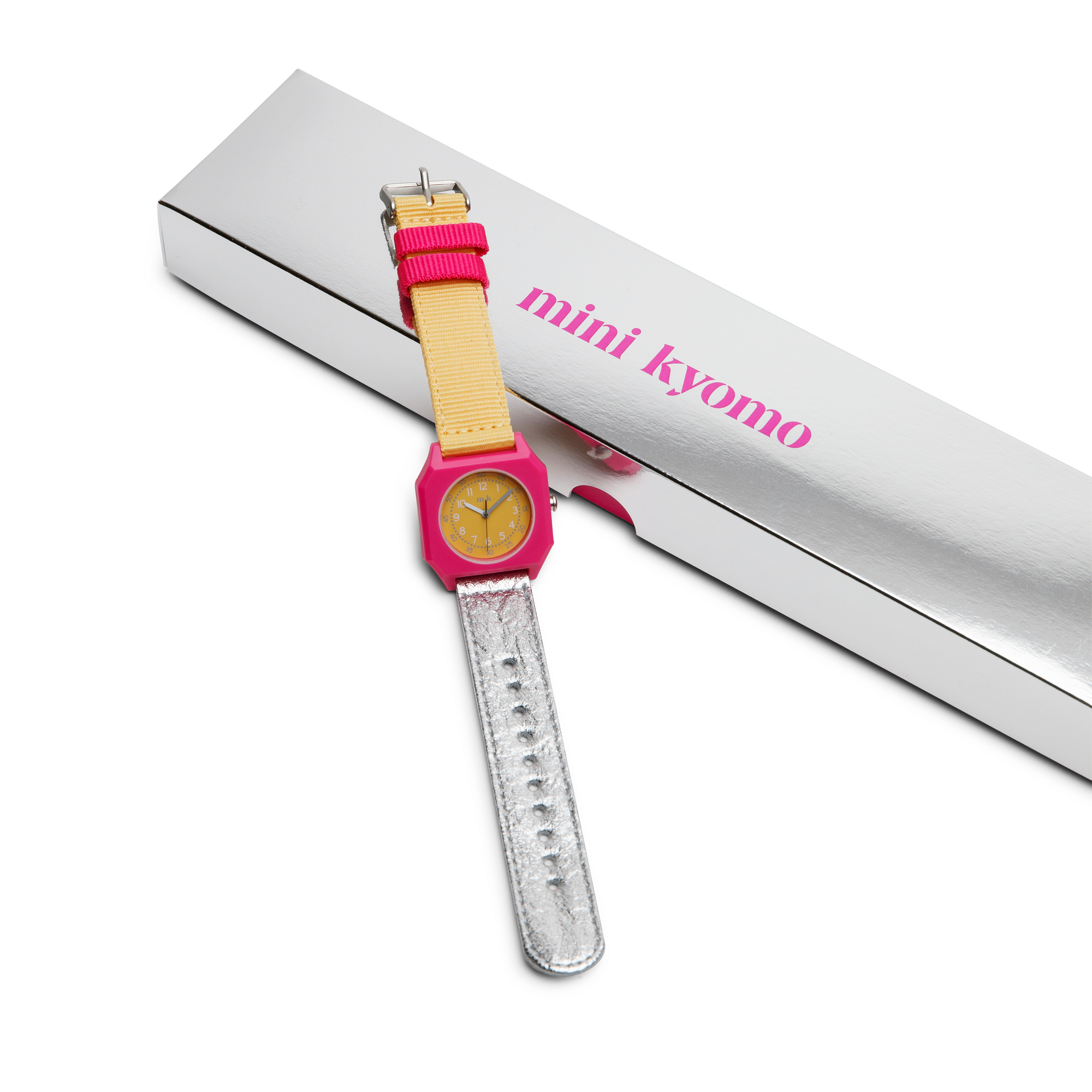 Children's watch with pink strap and ruler on a white background, branded 'mini kyomo