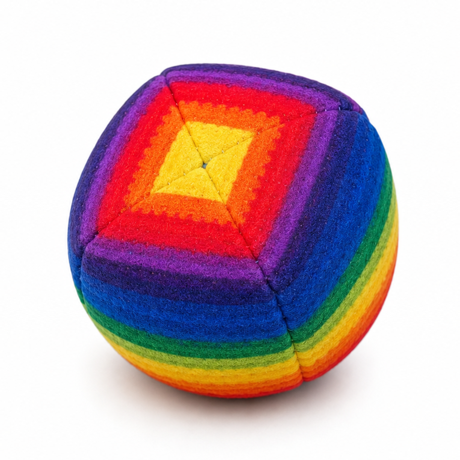 Multicolored cube-shaped toy on a white background
