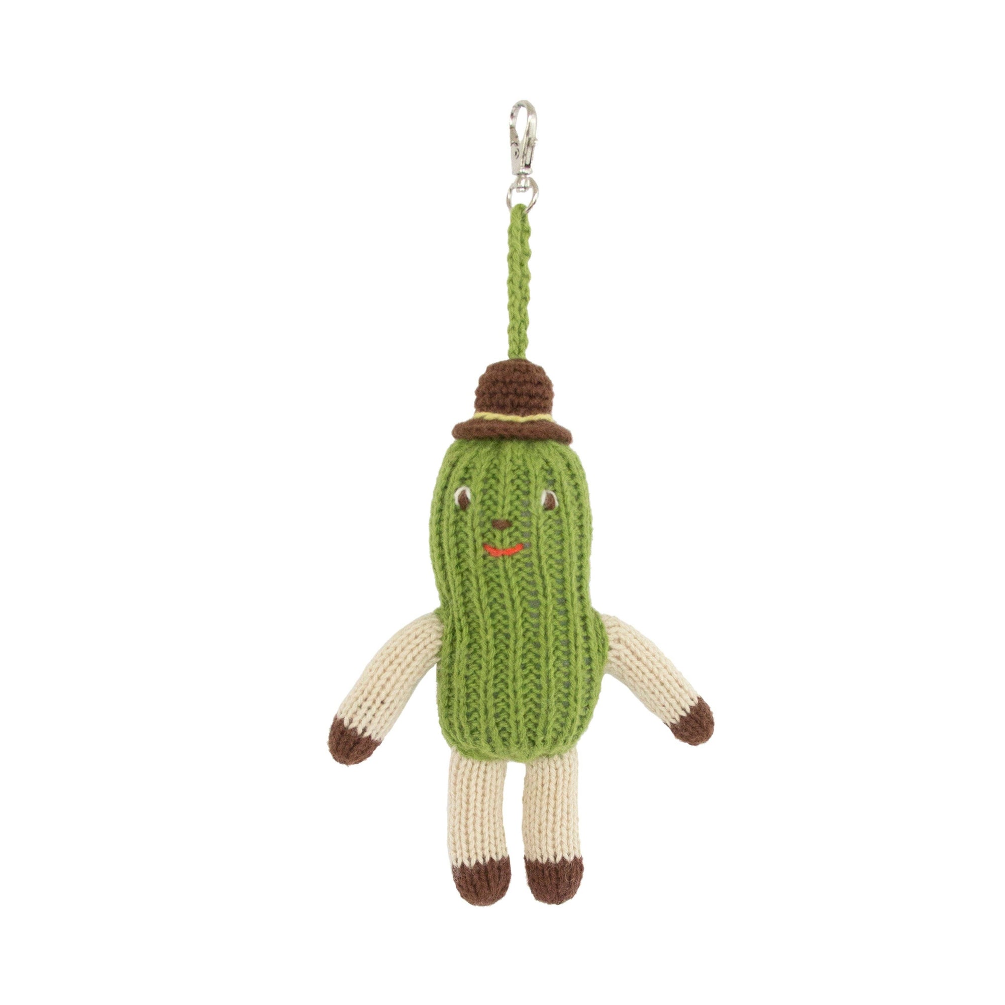Knitted pickle character keychain on a white background