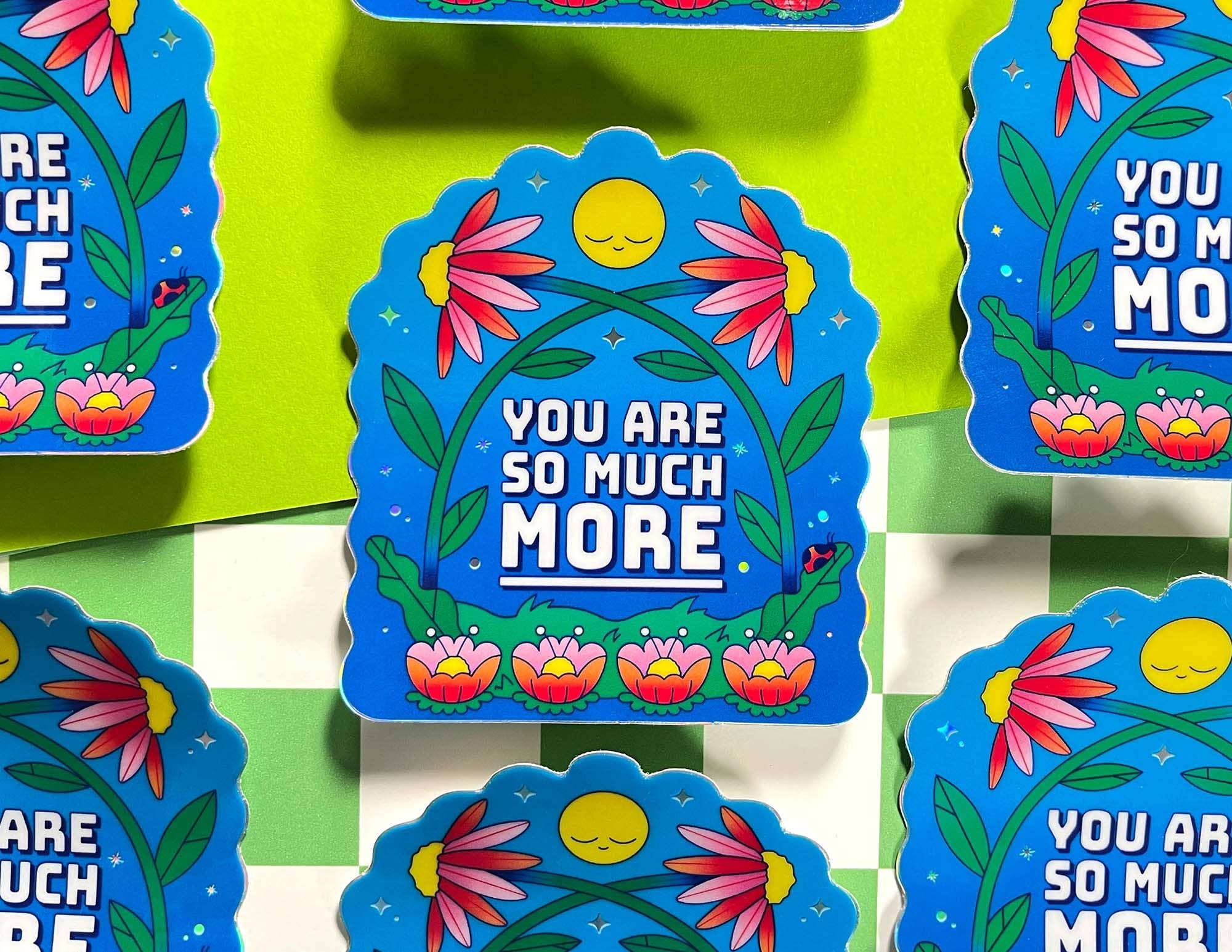 Decorative stickers with floral designs and motivational text on a green background