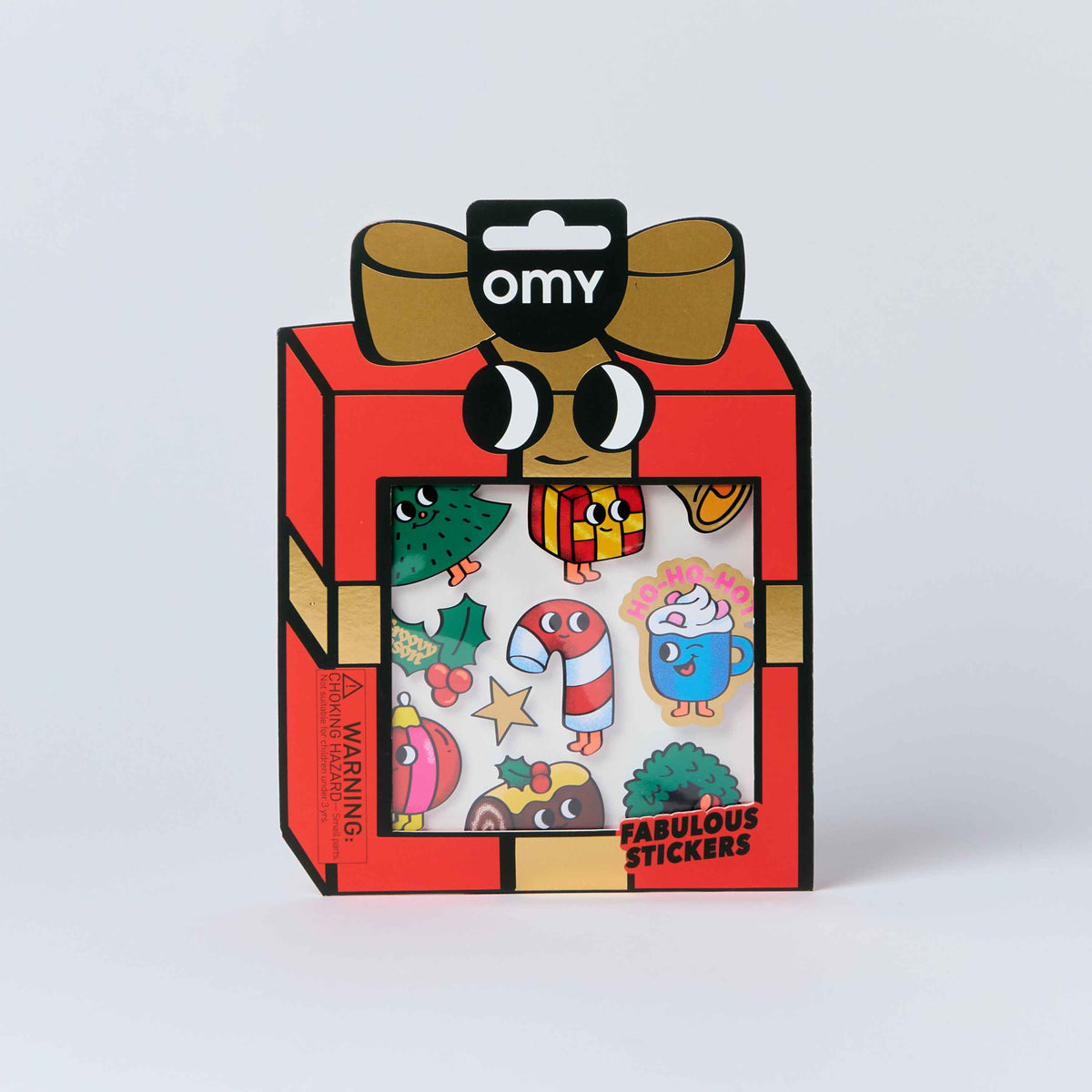 A package of Omy 'Fabulous Stickers' featuring a red gift box with a cartoon face and a clear window showing colorful Christmas-themed stickers inside.