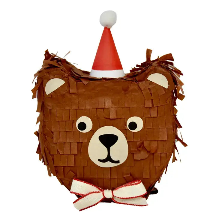 A brown bear-shaped piñata party decoration with a red and white Santa hat and a red-and-white bow, shown on a plain white background.