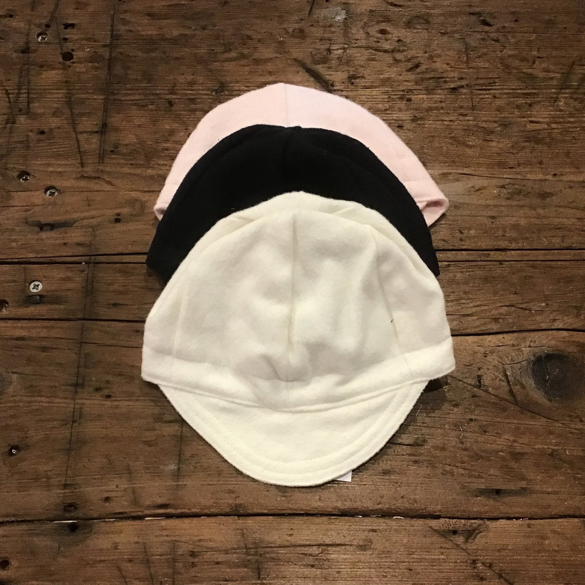 pink, black and cream caps