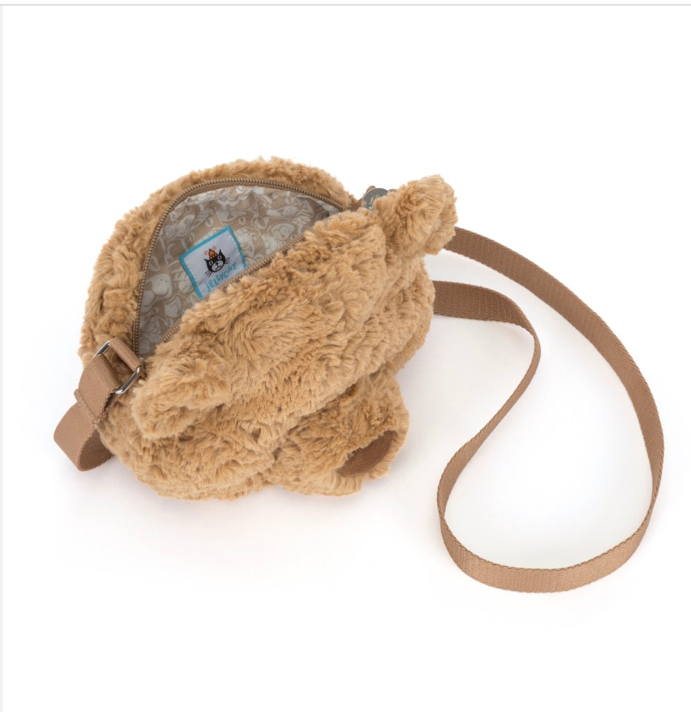 Brown fuzzy bag with a strap on a white background