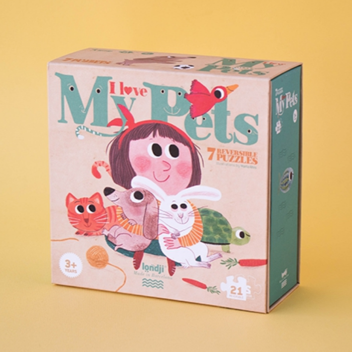 A colorful puzzle box with illustrations of various animals and a cartoon girl with pets.