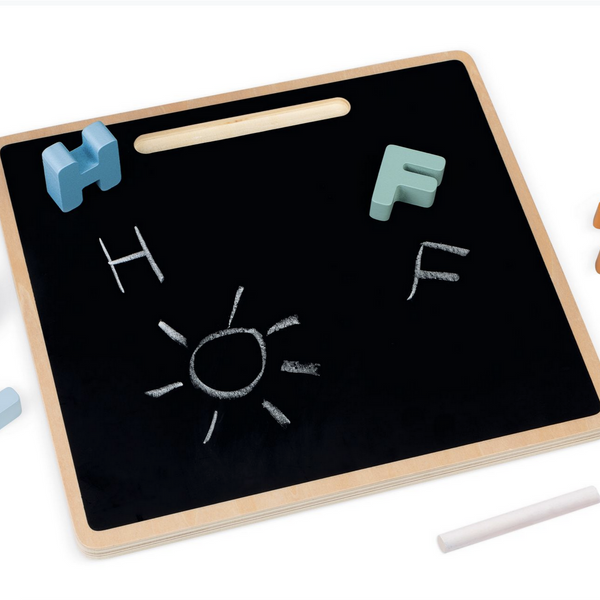 backside of puzzle board with black chalk board and chalk with puzzle pieces H and F and a sun and H and F written in chalk