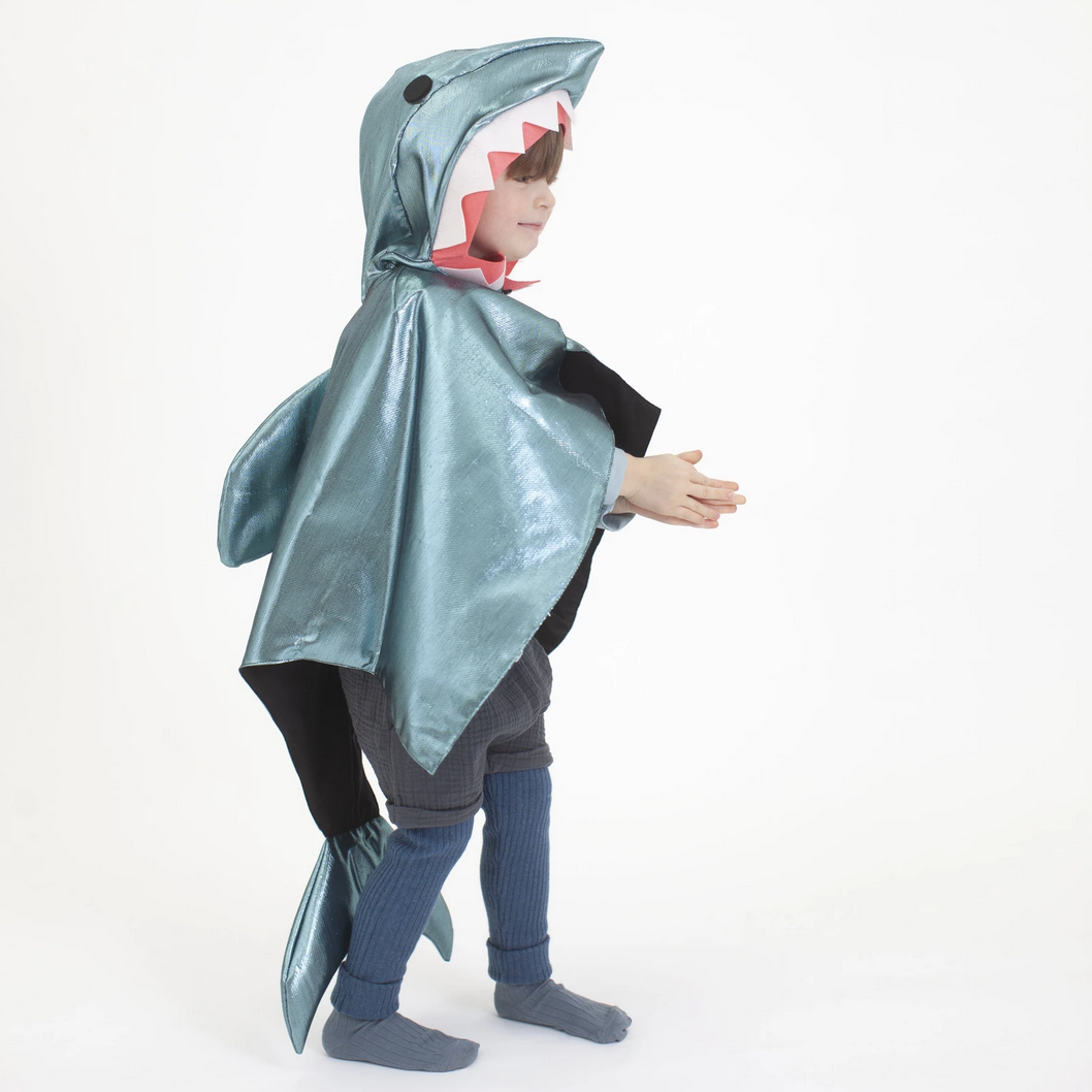 side view of child in shark costume