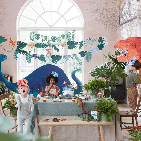 room decorated with dinosaur paper garland on a string