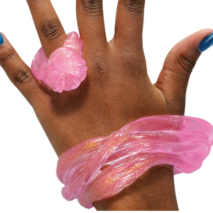 pink transparent putty wraped around hand