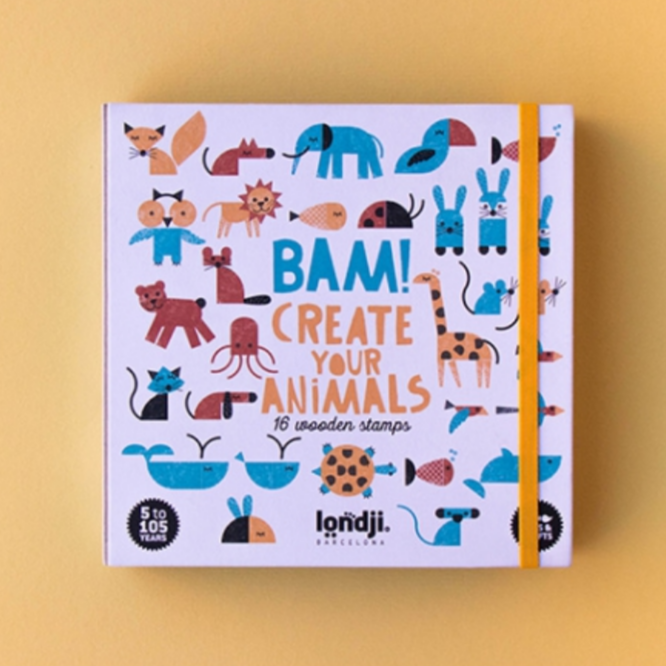A colorful children's craft kit titled 'Bam! Create Your Animals' with 16 wooden stamps designed to create various animals, presented on a yellow background.