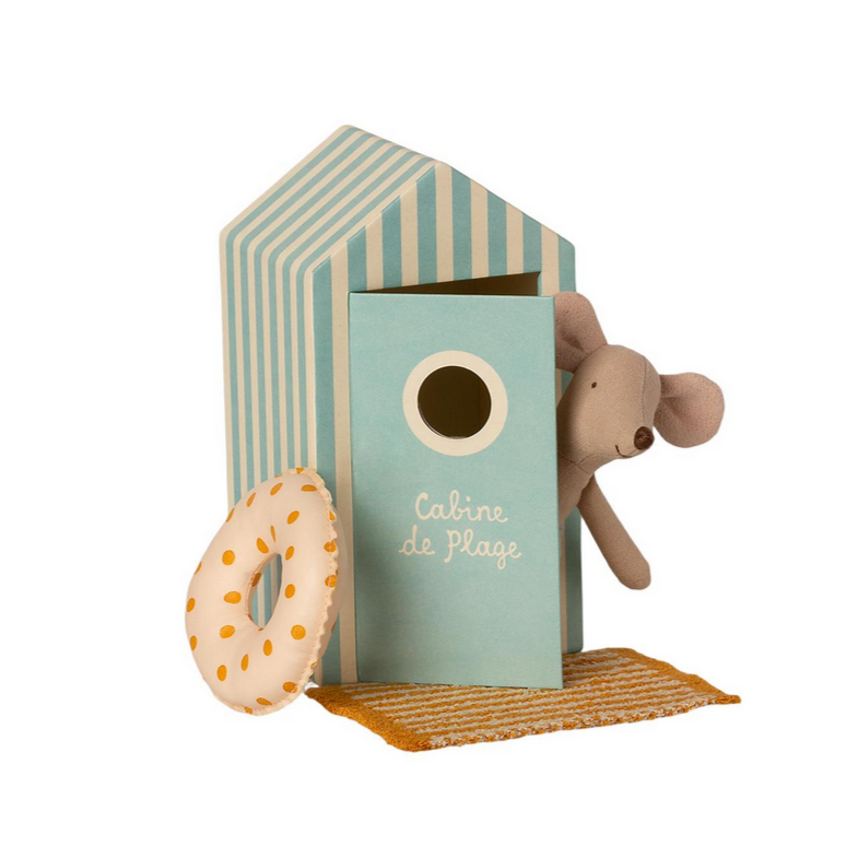 little brother mouse in swim trunks with yellow polka dot inner tube standing on yellow striped towel, peeking outside of dressing room box