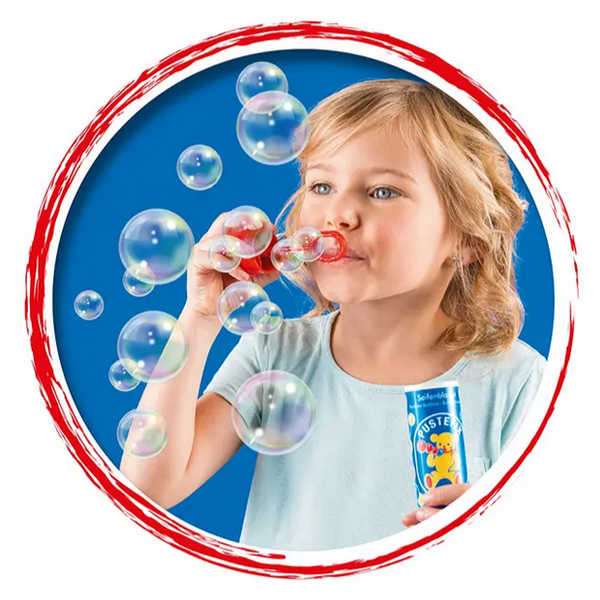 This is a picture of a little girl blowing bubbles.