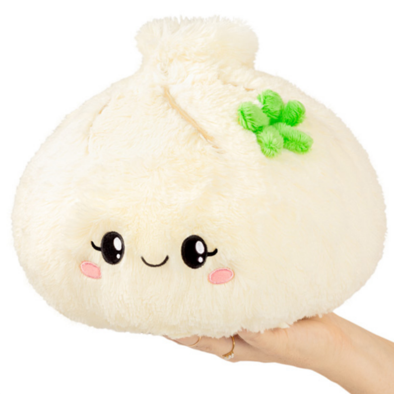 dumpling stuffie with eyes and green flower