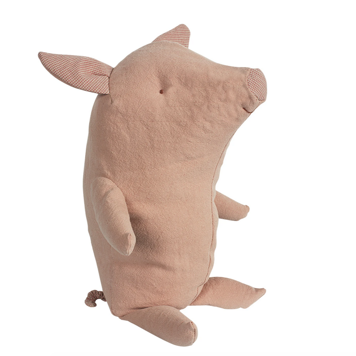 side view of pink cloth pig sitting