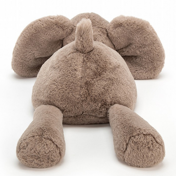 fuzzy elephant plush laying down from behind