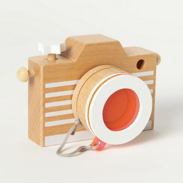 wooden camera with pink/orange lens 