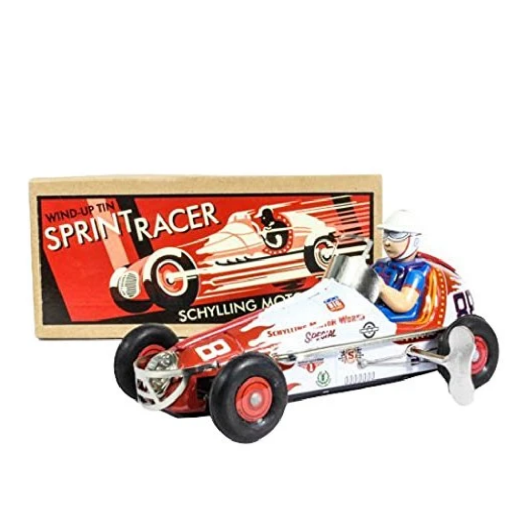 metal wind up race car and driver in front of box