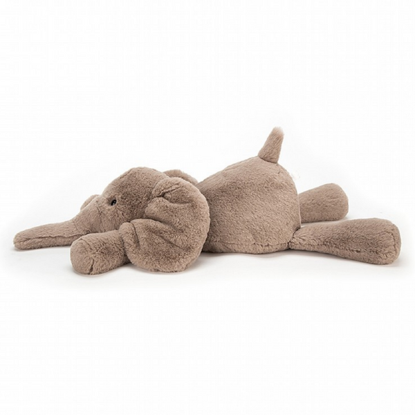 fuzzy elephant plush laying down to the side