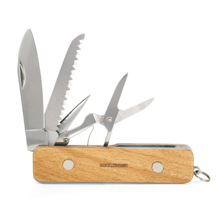 pocket knife showing scissors, saw awl and knife