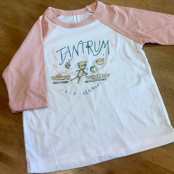 pink sleeved shirt with graphic of toys that reads "Tantrum cole clement"